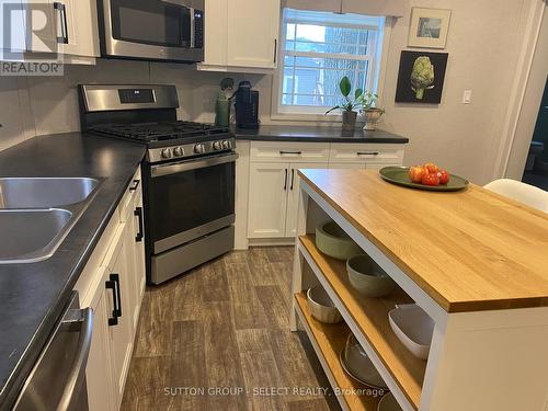 Generous Countertops - 55 - 22790 Amiens Road, Middlesex Centre (Komoka), ON - Indoor Photo Showing Kitchen With Double Sink