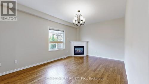 15 Orleans Ave, Barrie, ON - Indoor Photo Showing Other Room With Fireplace