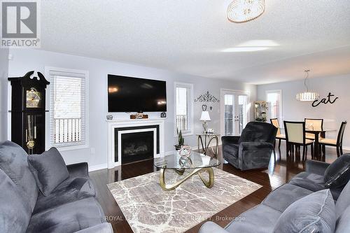 21 Old Trafford Dr, Trent Hills, ON - Indoor Photo Showing Living Room With Fireplace