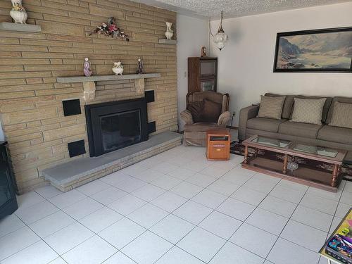 201 Langworthy Street, Schreiber, ON - Indoor Photo Showing Living Room With Fireplace