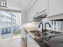 #228 -58 Marine Parade Dr, Toronto, ON  - Indoor Photo Showing Kitchen With Double Sink 