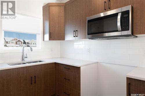 7632 Mapleford Boulevard, Regina, SK - Indoor Photo Showing Kitchen With Double Sink