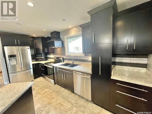 357 7Th Avenue W, Melville, SK - Indoor Photo Showing Kitchen With Double Sink With Upgraded Kitchen