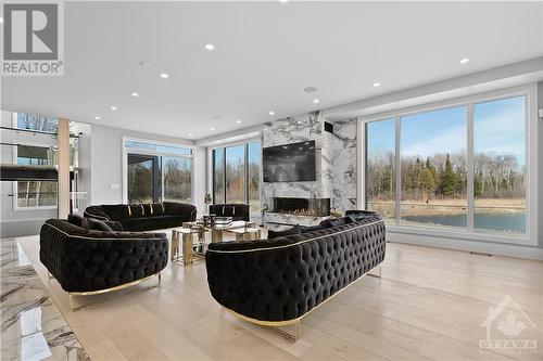 493 Shoreway Drive, Greely, ON - Indoor Photo Showing Living Room With Fireplace