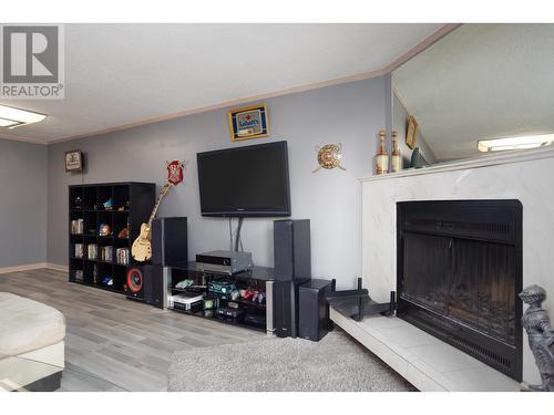 290 Mills Road Unit# 202, Kelowna, BC - Indoor Photo Showing Other Room With Fireplace