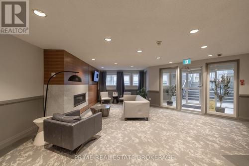 #214 -15 Jacksway Cres, London, ON - Indoor With Fireplace