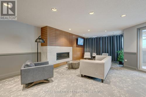#214 -15 Jacksway Cres, London, ON - Indoor With Fireplace