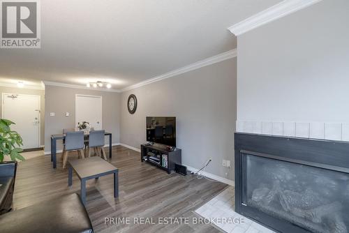 #214 -15 Jacksway Cres, London, ON - Indoor Photo Showing Living Room With Fireplace