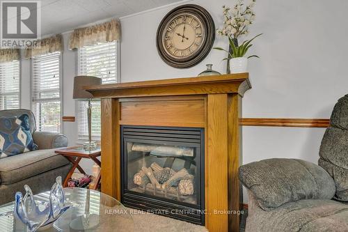#9 -580 Beaver Creek Rd, Waterloo, ON - Indoor Photo Showing Living Room With Fireplace