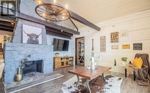 1322 Black Beach Lane, Ramara, ON - Indoor Photo Showing Living Room With Fireplace