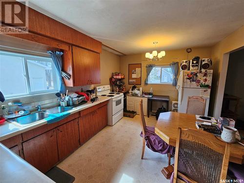 704 1St Street E, Meadow Lake, SK - Indoor Photo Showing Kitchen With Double Sink