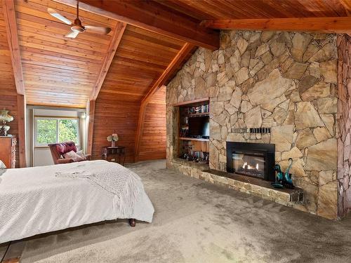 7764 Broomhill Rd, Sooke, BC - Indoor Photo Showing Bedroom With Fireplace