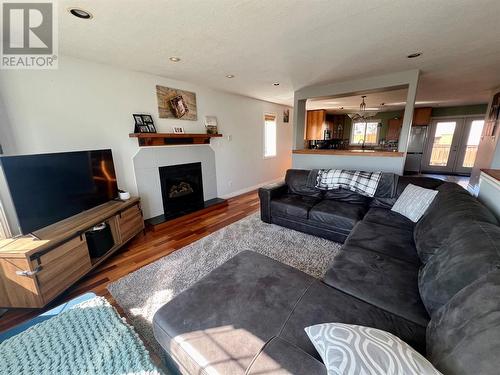 1336 92 Avenue, Dawson Creek, BC - Indoor Photo Showing Living Room With Fireplace