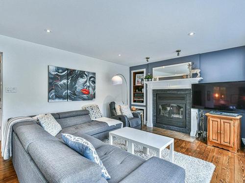 Living room - 525 Rue Du Clos-De-Paulilles, Prévost, QC - Indoor Photo Showing Living Room With Fireplace