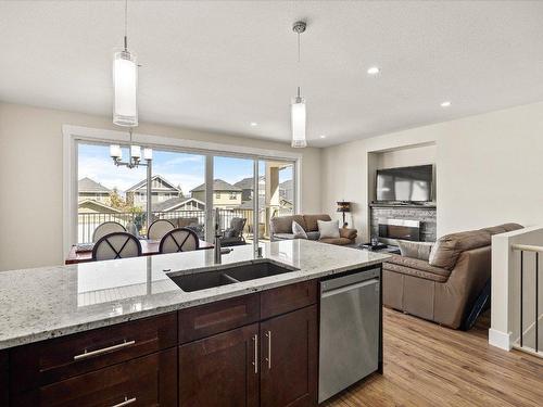 1274 Bergamot Avenue, Kelowna, BC - Indoor Photo Showing Kitchen With Fireplace With Double Sink