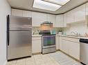 303-3175 De Montreuil Court, Kelowna, BC  - Indoor Photo Showing Kitchen With Double Sink 