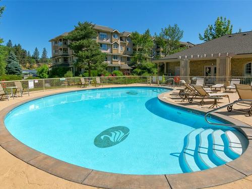 303-1960 Enterprise Way, Kelowna, BC - Outdoor With In Ground Pool With Backyard