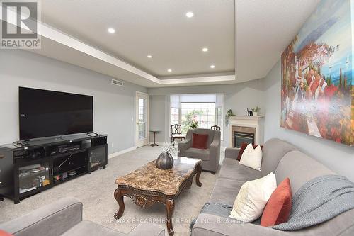 308 - 990 Golf Links Road, Hamilton, ON - Indoor Photo Showing Living Room With Fireplace