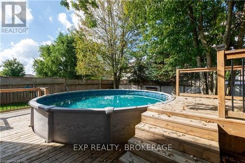 27 Robin St, North Middlesex, ON - Outdoor With Above Ground Pool With Deck Patio Veranda
