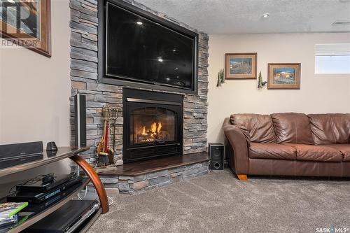 23 Dawn Road, Moose Jaw Rm No. 161, SK - Indoor Photo Showing Living Room With Fireplace