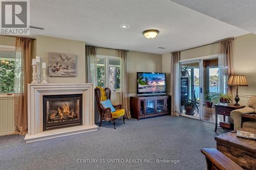 1223 Harrington Dr, Smith-Ennismore-Lakefield, ON - Indoor Photo Showing Living Room With Fireplace