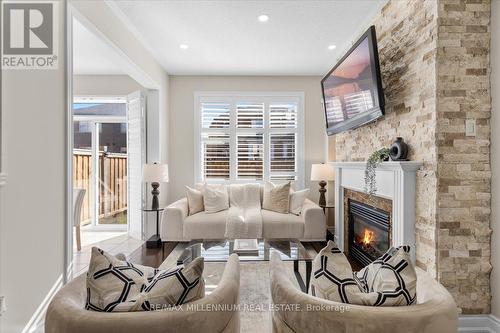 44 Orangeblossom Tr, Brampton, ON - Indoor Photo Showing Living Room With Fireplace