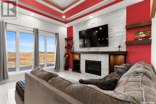 126 Vestor Drive, Pilot Butte, SK - Indoor Photo Showing Living Room With Fireplace