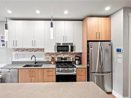 105-3315 Radiant Way, Langford, BC - Indoor Photo Showing Kitchen With Stainless Steel Kitchen With Double Sink