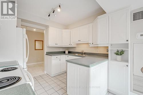 303 - 2190 Lakeshore Road, Burlington, ON - Indoor Photo Showing Kitchen With Double Sink