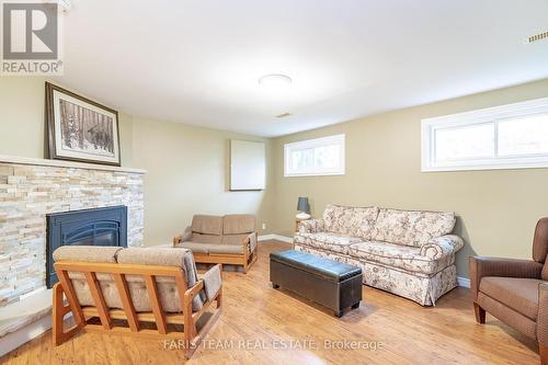 3843 East Street, Innisfil, ON - Indoor Photo Showing Living Room With Fireplace