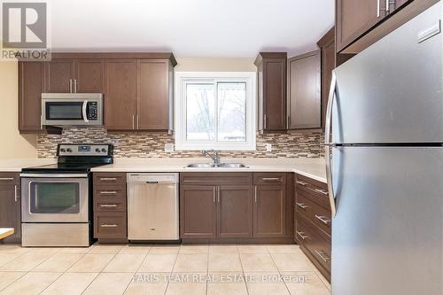 3843 East Street, Innisfil, ON - Indoor Photo Showing Kitchen With Double Sink