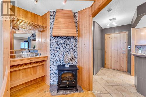 #109 -1001 Cedarglen Gate, Mississauga, ON - Indoor Photo Showing Other Room With Fireplace