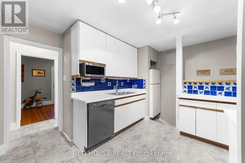 68 Nesbitt Dr, Toronto, ON - Indoor Photo Showing Kitchen With Double Sink
