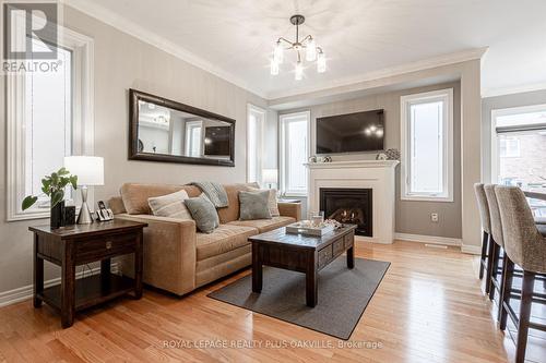 750 Sudgen Terrace Terrace W, Milton, ON - Indoor Photo Showing Living Room With Fireplace