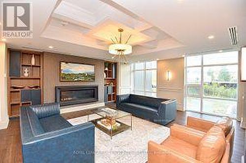 #909 -460 Dundas St E, Hamilton, ON - Indoor Photo Showing Living Room With Fireplace