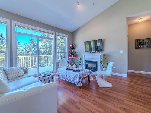 200-830 Varsity Way, Nanaimo, BC - Indoor Photo Showing Living Room With Fireplace