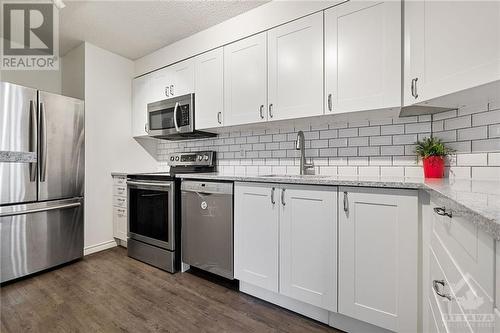 Kitchen (protective film on dishwasher to be removed) - 470 Laurier Avenue W Unit#508, Ottawa, ON - Indoor Photo Showing Kitchen With Upgraded Kitchen