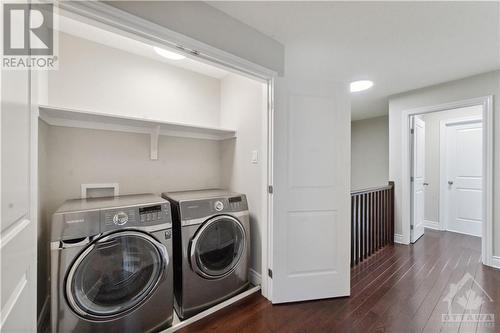 Convenient laundry on second level, tucked into closed area - 109 Hawkeswood Drive, Ottawa, ON - Indoor Photo Showing Laundry Room