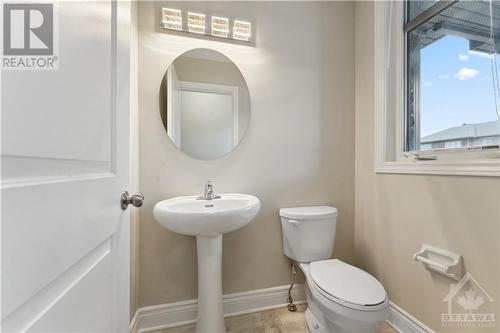 Powder room on main floor with window - 109 Hawkeswood Drive, Ottawa, ON - Indoor Photo Showing Bathroom