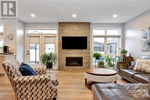 68 Hubble Heights, Manotick, ON - Indoor Photo Showing Living Room With Fireplace