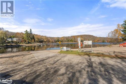 Public beach and boat launch onto Eagle Lake view 1 - 1257 Sir Sams Road, Haliburton, ON - Outdoor With Body Of Water With View