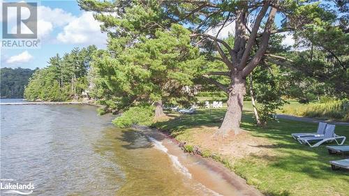 Beach - 3876 Muskoka 118 Road W Unit# Sandfield 1 Week 3, Port Carling, ON - Outdoor With Body Of Water With View