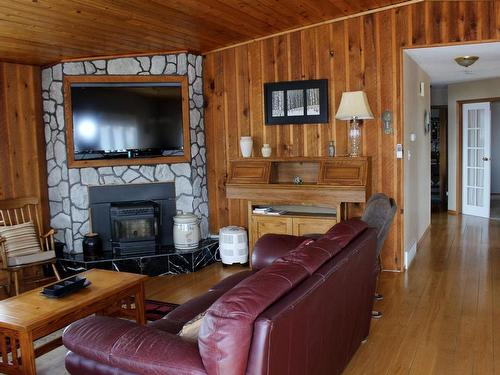 100 River Avenue E, Rainy River, ON - Indoor Photo Showing Living Room With Fireplace