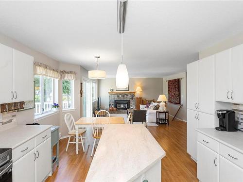 6158 Icarus Dr, Nanaimo, BC - Indoor Photo Showing Kitchen With Fireplace