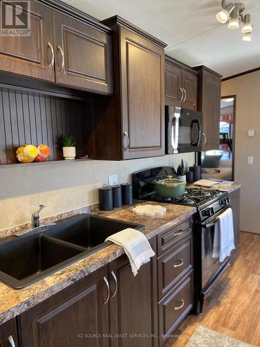 158 - 1501 Line 8 Road, Niagara-On-The-Lake, ON - Indoor Photo Showing Kitchen With Double Sink