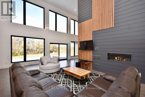 57 Glenhuron Drive, Springwater, ON - Indoor Photo Showing Living Room With Fireplace