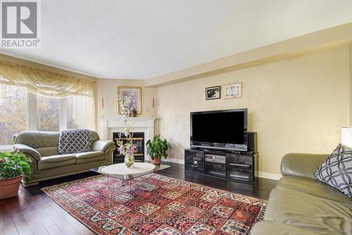1045 Knotty Pine Grove, Mississauga, ON - Indoor Photo Showing Living Room With Fireplace