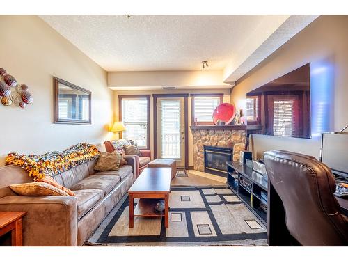 307 - 1500 Mcdonald Avenue, Fernie, BC - Indoor Photo Showing Living Room With Fireplace
