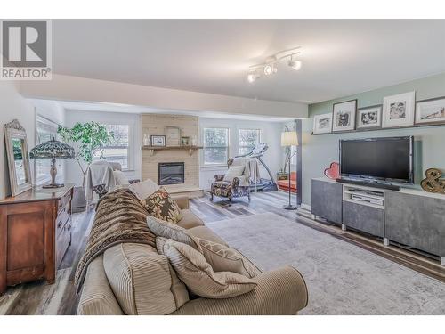 7243 Rainbow Crescent, Canim Lake, BC - Indoor Photo Showing Living Room With Fireplace