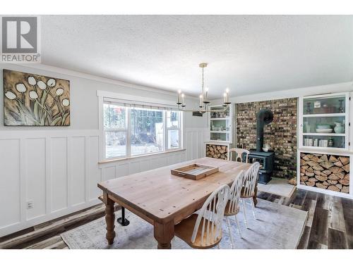 7243 Rainbow Crescent, Canim Lake, BC - Indoor Photo Showing Dining Room With Fireplace